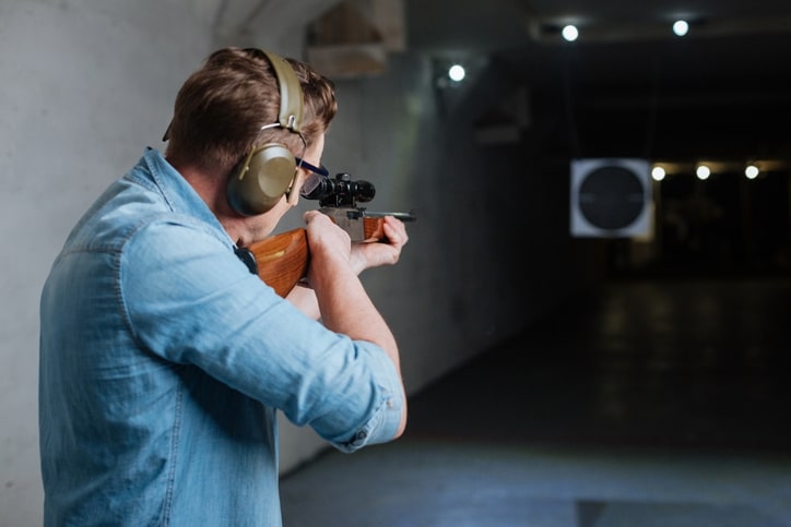 Handsome serious man looking at the target